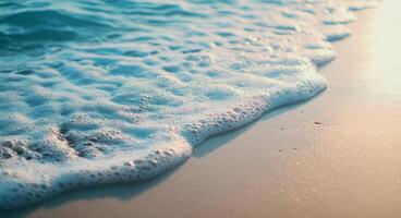Gentle ocean waves lapping against the shore at sunset with soft golden light photo