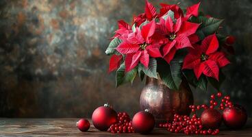 Poinsettia arrangement with red ornaments on a wooden table during the holiday season photo