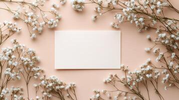 Elegant floral arrangement with empty card on soft pink background for creative messaging photo