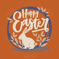 Happy Easter inscription or holiday wish written with cursive font and bunny inside round frame or wreath decorated by leaves on orange background. Hand drawn illustration for greeting card. vector
