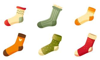 Set of stylish cotton and wool socks with different textures, colors, patterns and types. One sock on a white background. Warm wool socks with cute patterns. Autumn and winter socks. vector