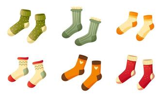 Set of stylish cotton and wool socks with different texture, color, pattern and type. Two pairs of identical socks on a white background. Warm wool socks with cute patterns. Autumn and winter socks. vector