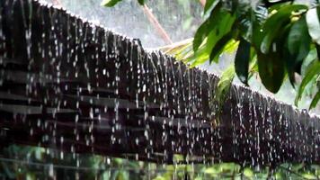 4x slow motion of rain falling on a roof video