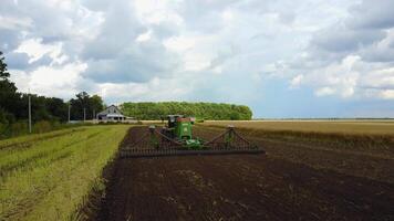 Plow Attached To A Tractor On A Field video