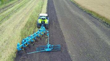 Plow Attached To A Tractor On A Field video