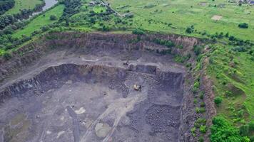 Dumpers and machines are working in the quarry mine video
