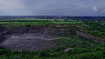 Panorama aerial view open-pit mine showing the various layers of quarrying video