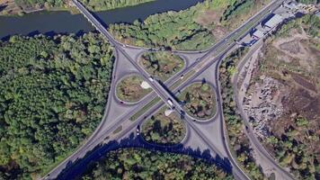 Aerial view of a highway intersection with a clover-leaf video