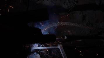 Welder uses torch to make sparks video