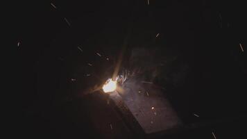 Welder uses torch to make sparks video