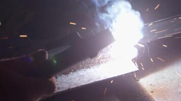 Welder uses torch to make sparks video