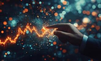 A persons hand touches a digital graph displaying upward trends in a modern setting photo