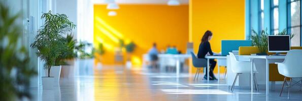 Bright modern office space with creative workstations and plants during daytime hours photo