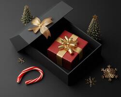 Festive gift box with gold ribbon and candy canes on a dark background during the holiday season photo