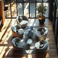 Cozy lounge area with modern chairs and tables in bright natural light during the day photo