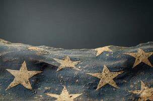 Tattered American flag displaying faded stars and worn fabric against a dark background photo