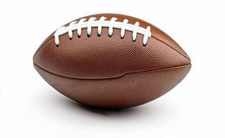 Brown leather football on a plain background, emphasizing its texture and stitching details photo