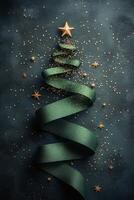 Decorative green ribbon spirals into a Christmas tree shape adorned with golden stars and glitter photo