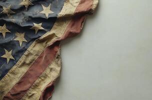 American flag draped subtly against a textured gray background in a minimalistic setting photo