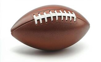 A close up view of a classic brown football displayed on a clean white background photo