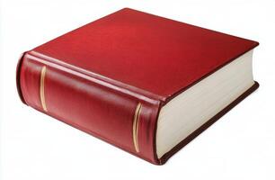 A classic red hardcover book resting on a clean white surface in bright light photo