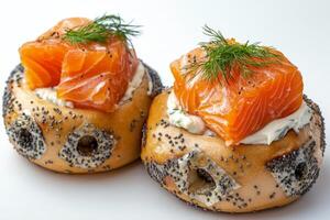 Delicious bagel with cream cheese, smoked salmon, and fresh dill arranged in a circular presentation photo
