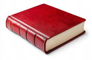 A classic red hardcover book resting on a clean white surface in bright light photo