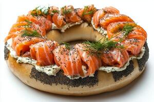 Delicious bagel with cream cheese, smoked salmon, and fresh dill arranged in a circular presentation photo