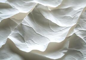 Textured white paper layers creating a delicate and intricate pattern in soft lighting photo