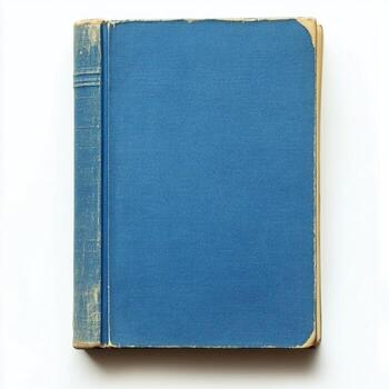A closed blue fabric covered book lying on a white surface under soft lighting photo