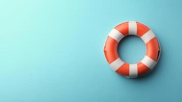 Bright yellow lifebuoy floating on a teal background, symbolizing safety and rescue at sea photo