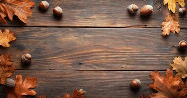 Vibrant autumn leaves and acorns arranged on a rustic wooden table in a warm, inviting setting photo