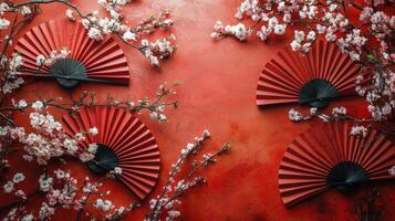 Red background with pink cherry blossoms and decorative circular fans in harmony photo