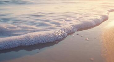 Gentle ocean waves lapping against the shore at sunset with soft golden light photo