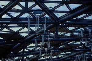 Modern building ceiling composed of metal beams and glass panels. Contemporary architecture elements photo