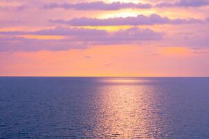 seascape and sky with clouds on sunset in the sea photo
