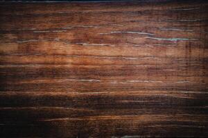 Dark wood texture background surface with old natural pattern. Walnut wood texture. Close up walnut planks texture background. photo