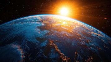 The sun rises majestically over the horizon of Earth, casting a warm glow photo