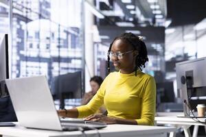 Back end developer focusing on fixing applications issues, dealing with databases and server configuration. Woman optimizing company software for improved performance and scalability photo