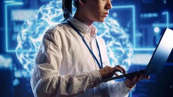 Seasoned IT inspector in data center uses artificial intelligence computing simulating human brain thought processes. Capable tech support executive works on laptop with AI machine learning algorithms photo