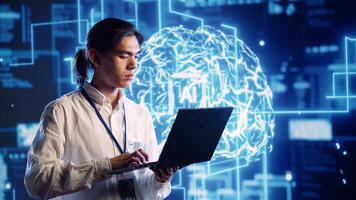 Trained IT practitioner in data center uses artificial intelligence computing simulating human brain thought processes. Certified tech support admin works on laptop with AI machine learning algorithms photo