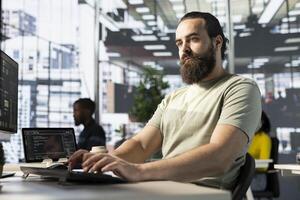 Programmer conducting experiments and tests to optimize machine learning models for performance and accuracy. IT employee in office analyzing and interpreting complex data photo
