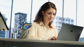 Powerful female entrepreneur focuses on strategic planning, setting a clear vision and goals for the corporation and aligning resources to achieve growth. Ambition and determination. Camera A. photo