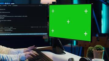 Cybersecurity expert uses green screen computer to look for security vulnerabilities and injected malware, close up. Admin installing fortified code on chroma key PC to prevent cyber attacks, camera A photo