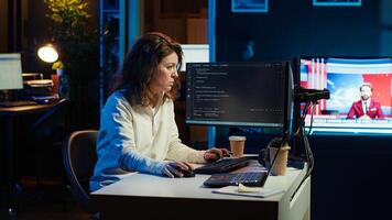 Programmer closing backpack, leaving home office after filtering malicious traffic from cybercriminals. Woman finishing job shift after being done with preventing malware, camera A photo
