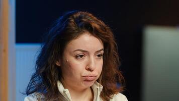Upset teleworking engineer worried after failing to secure company servers from virus attacks, close up. Anxious woman stressed about being unable to build firewalls protecting data, camera A photo