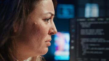 Angry programmer feeling frustration after failing to secure company servers from virus attacks. Irritated woman releasing pent up emotions, unable to build firewalls protecting data, camera B photo