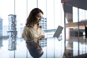 Determined woman leader developing a strategic plan for business growth, aligning the company efforts with the enterprise vision and market opportunities for global expansion. photo