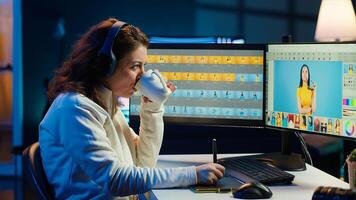 Photographer using editing software to edit photos and make adjustments while enjoying cup of coffee. Specialist color correcting pictures while listening music in headphones, camera A