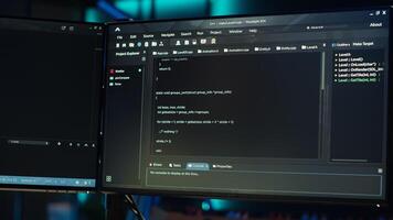 Technician doing software quality assurance, reading source code on PC before implementing it. IT admin inspecting coding on computer, looking to fix potential issues, camera A close up photo
